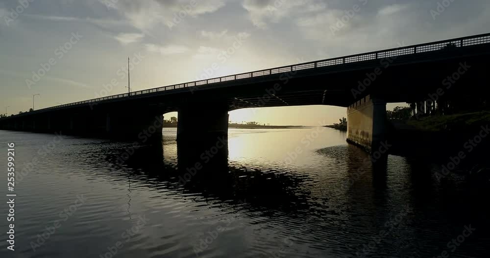 Flying under the a bridge at sunset. Flying under the a bridge at sunset.