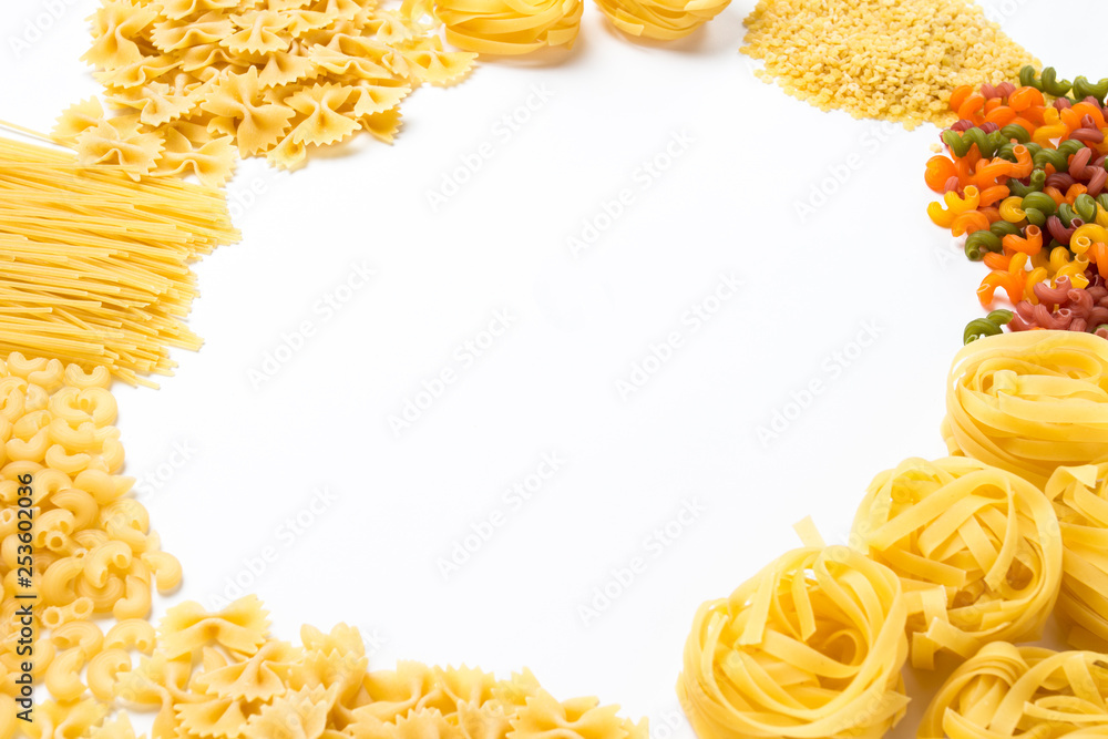 Italian pasta of various kinds on a white background. Flat lay, top view. circle shape Italian pasta of various kinds on a white background. Flat lay, top view. circle shape