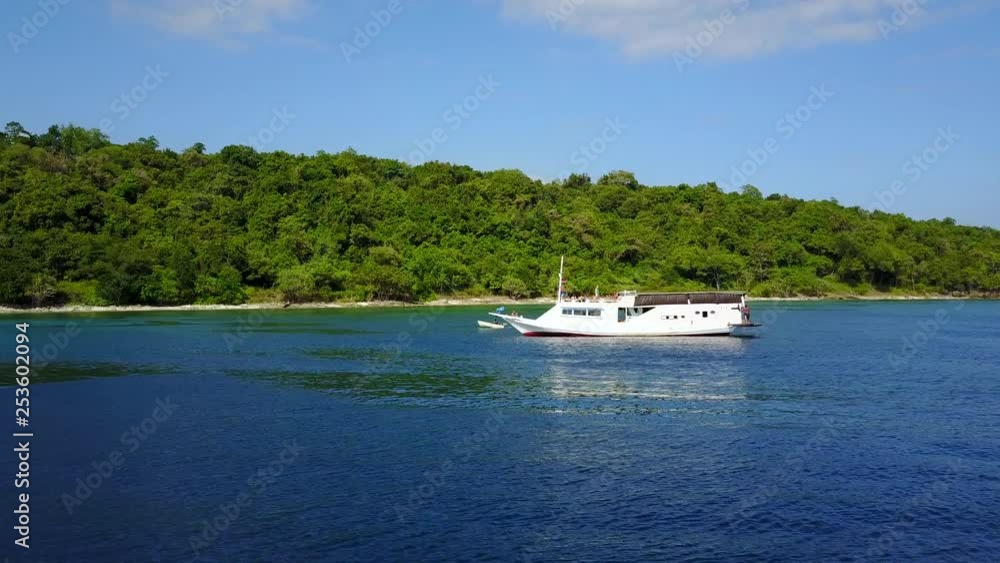 beautiful shore view in Komodo while passing a white boat beautiful shore view in Komodo while passing a white boat
