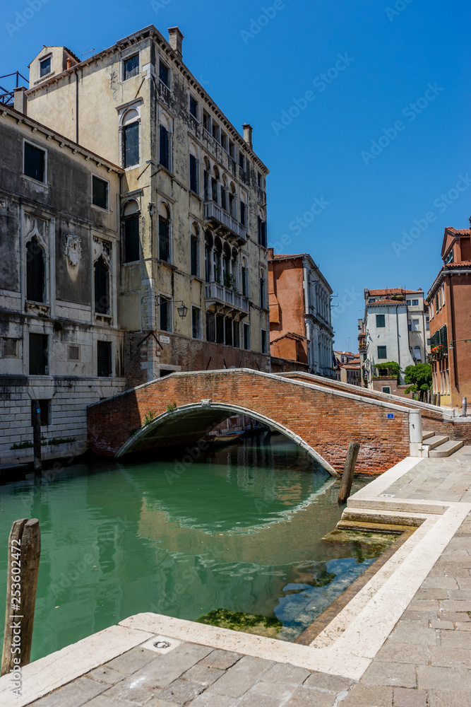 Italy, Venice, a bridge leading to a brick building