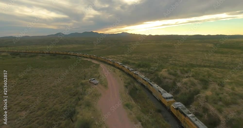Drone approaching trains being parked along a railroad in Arizona, America. Drone approaching trains being parked along a railroad in Arizona, America.