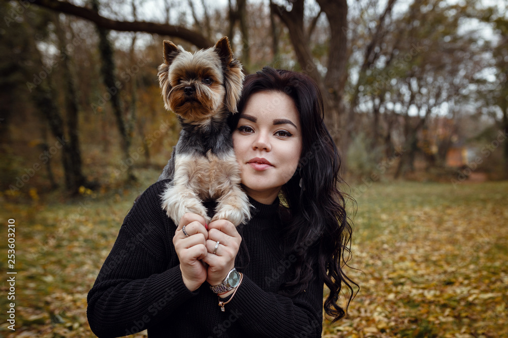 Cute young girl with yorkshire terrier dog Cute young girl with yorkshire terrier dog