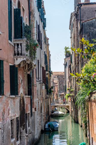 Italy, Venice, a narrow city street with old buildings in the background