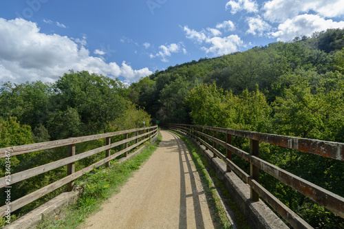 rural path across a bridge   its fences