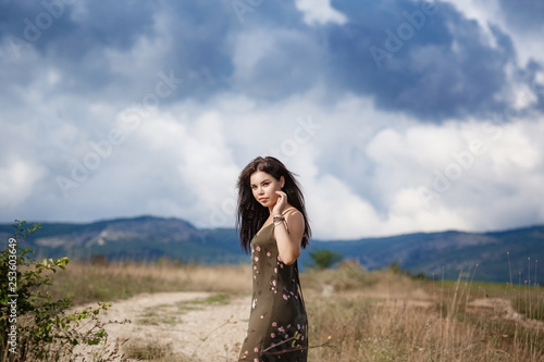 Smiling cheerful girl breathes a full breast and enjoys freedom