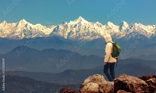 Male tourist hiker admire the majestic Kumaon Himalaya mountain range at Munsiyari Uttarakhand India.
