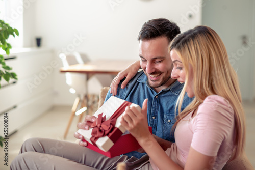 Young couple celebrating at home