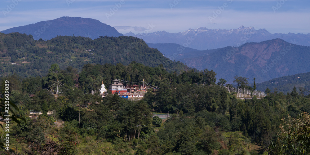 View of temple with mountain range in the background, Sikkim, India