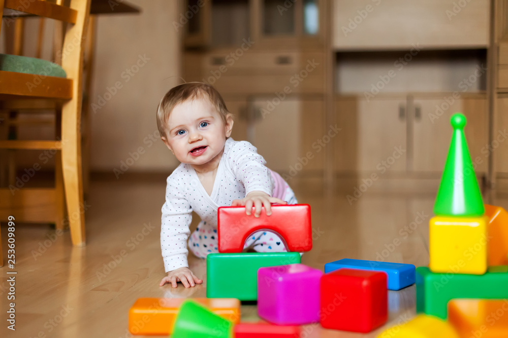 Baby with multi-colored designer at home Baby with multi-colored designer at home