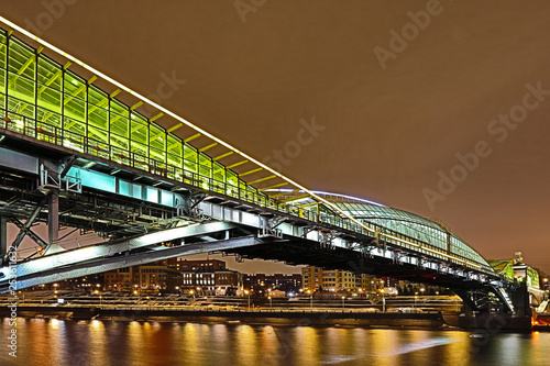 Moscow/Russia - March 6, 2019: Bogdan Khmelnitsky or Kievsky Pedestrian Bridge in Moscow in the March of 2019 year. The night view on Moskva river   photo