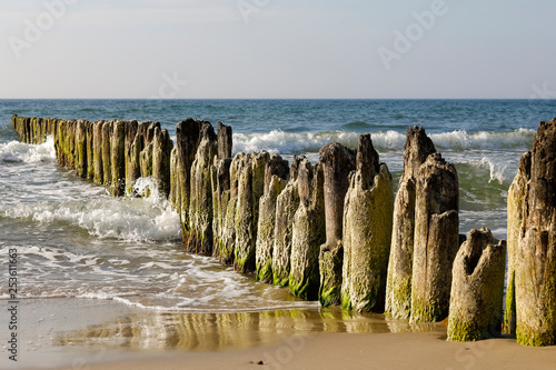 These thick wooden breakwaters are slightly damaged