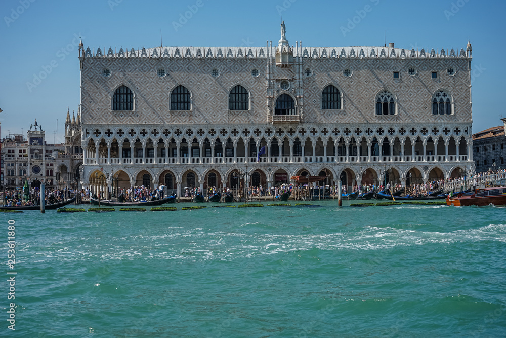 Italy, Venice, Doge's Palace, a group of people standing in front of a large building with Doge's Palace in the background