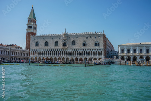 Italy, Venice, Doge's Palace, a castle like building with people in the water with Doge's Palace in the background