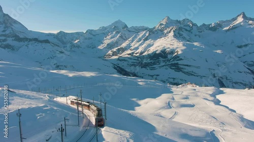 Matterhorn Mountain and Gornergrat Train in Winter at Sunset. Swiss Alps. Switzerland. Aerial View photo