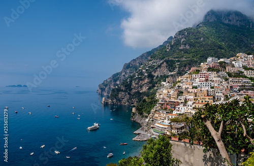 Panoramic view of beach and colorful buildings in Positano town at Amalfi Coast, Italy.