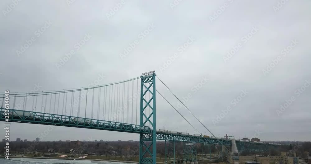 Trucks crossing the border into Windsor, Ontario via the Ambassador Bridge. Trucks crossing the border into Windsor, Ontario via the Ambassador Bridge.