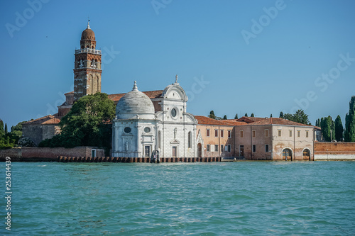 Italy, Venice, San Michele in Isola, BUILDINGS AT WATERFRONT AGAINST CLEAR SKY Murano