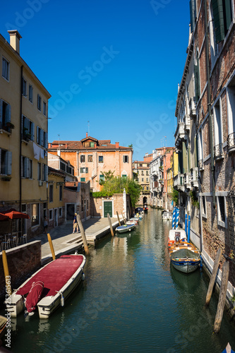 Italy, Venice, a narrow canal in a city © SkandaRamana