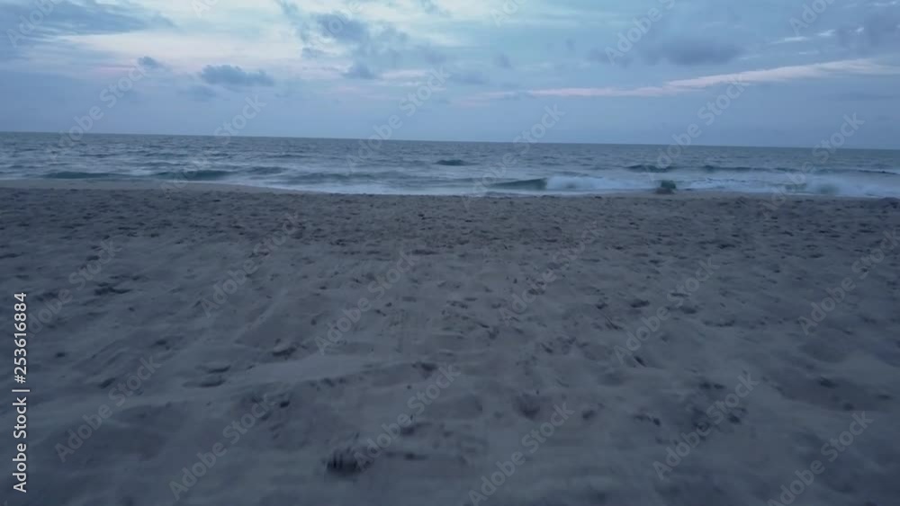 Aerial Beach Facing Ocean Low POV Pushing Out Over Vast Ocean At Dusk Aerial Beach Facing Ocean Low POV Pushing Out Over Vast Ocean At Dusk