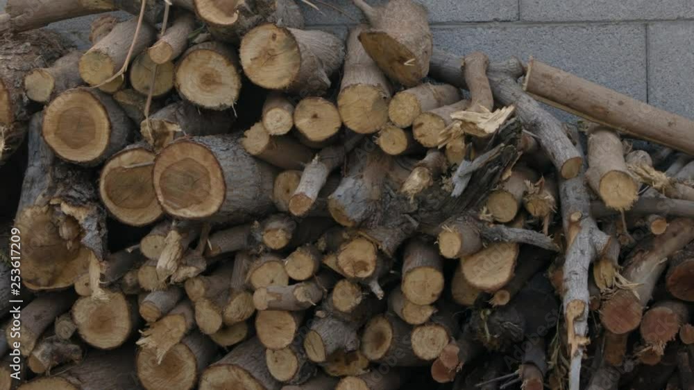 Stack of firewood up against a wall. Stack of firewood up against a wall.