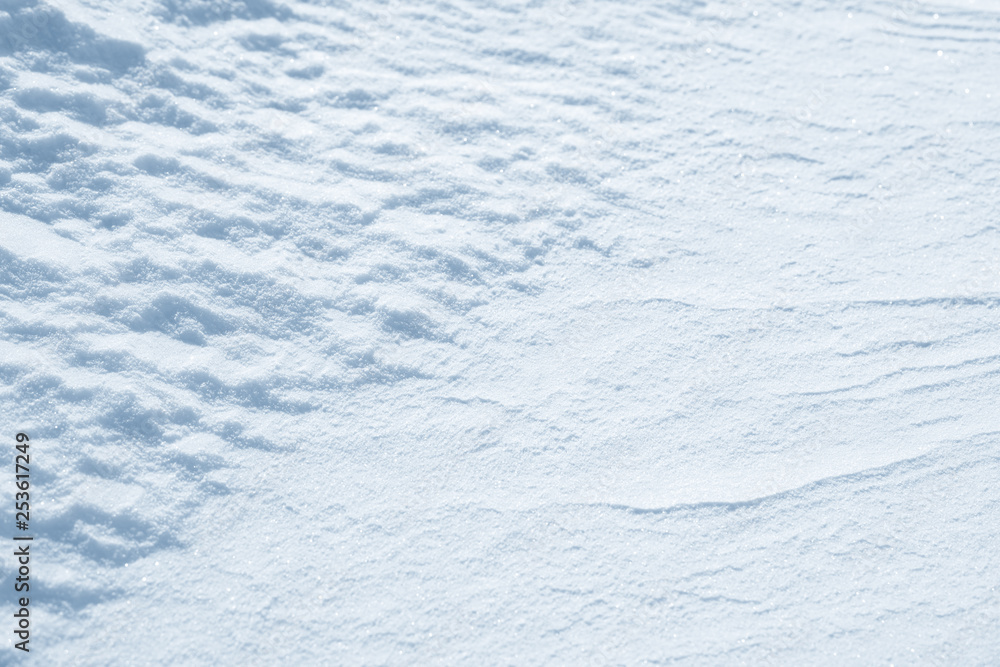 Fresh snow background texture. Winter background with snowflakes and snow mounds. Snow lumps.