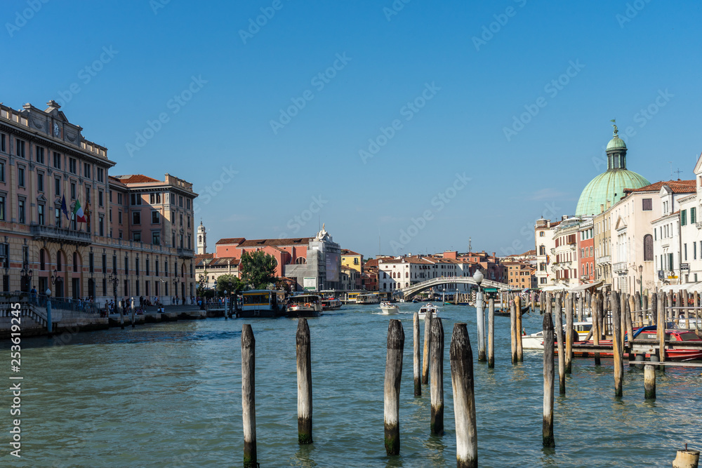 Italy, Venice, Grand Canal, a boat is docked next to a body of water with Grand Canal in the background