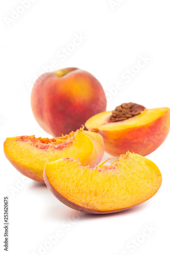 Group of peaches from whole to sliced isolated on white