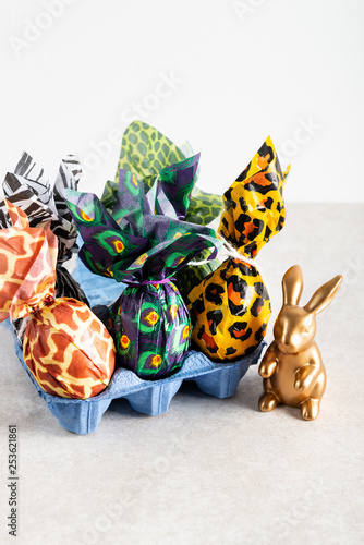 Easter eggs wrapped up in animal print paper
