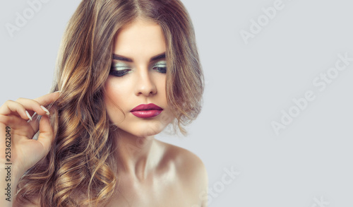 Portrait of a woman with beautiful make-up and hairstyle. Professional makeup and skin care.