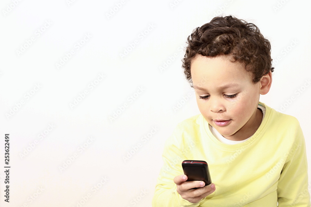 boy with mobile phone receiving a call boy with mobile phone receiving a call