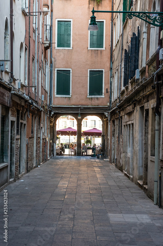 Europe, Italy, Venice, a narrow city street © SkandaRamana