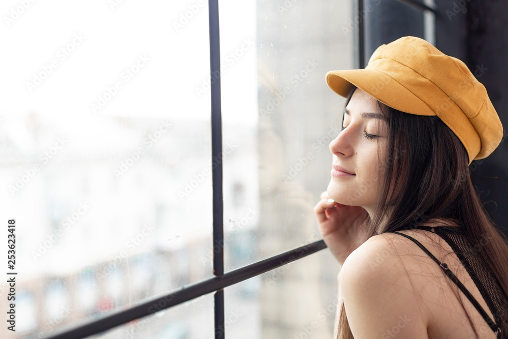Woman in Black Shirt and Purple Bucket Hat Doing a Pose · Free Stock Photo