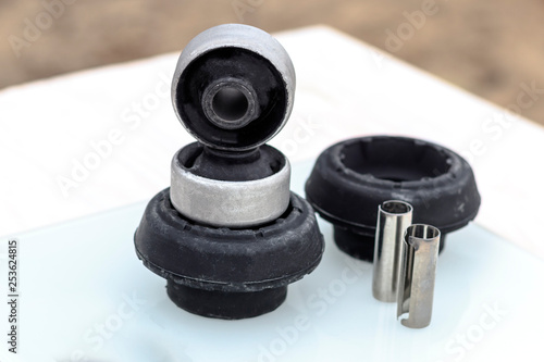 shock absorber support. silent block. metal sleeve. close-up. shallow depth of field