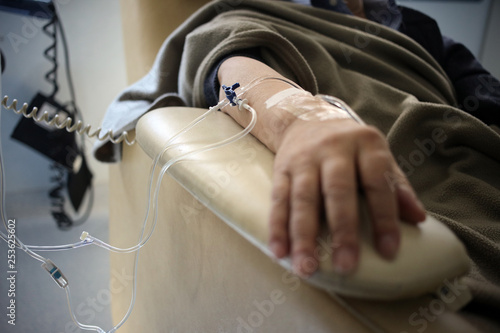 Buenos Aires, Argentina - March 08, 2019: Unidentified hand connected to a chemotherapy treatment in Buenos Aires, Argentina