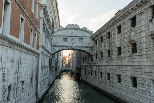 Italy, Venice, Bridge of Sighs, a close up of a stone building with Bridge of Sighs in the background