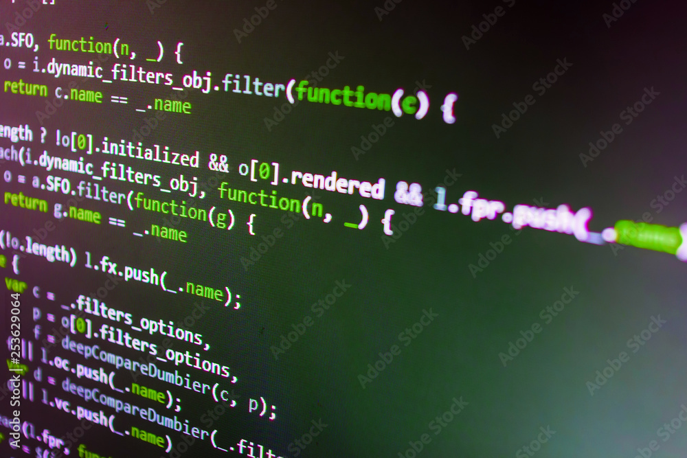 HTML code on the screen editor, dark screen. Modern binary code close ...