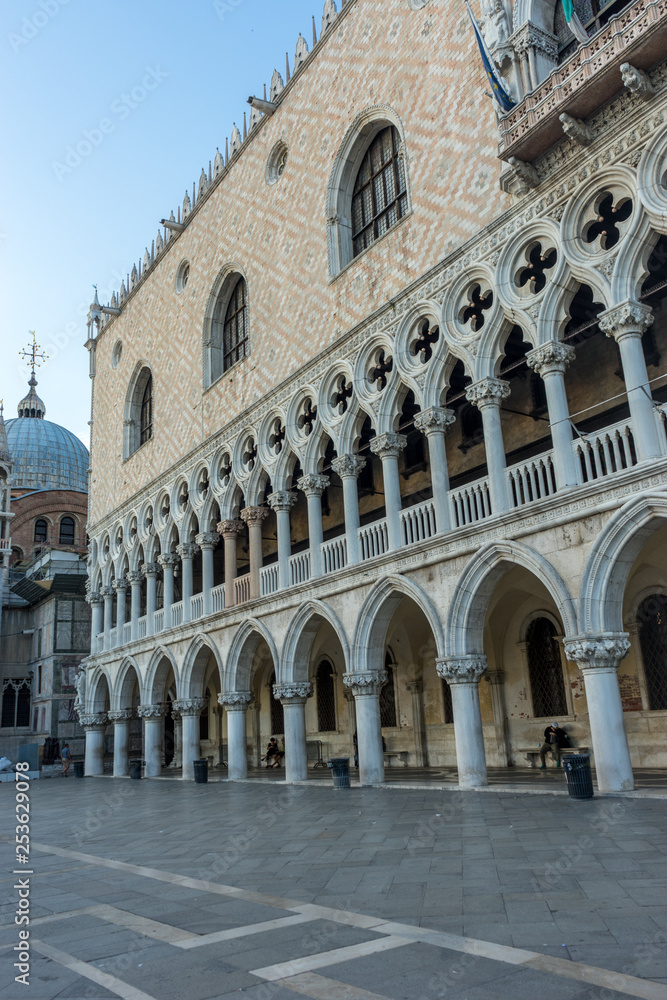 Italy, Venice, Doge's Palace, a stone building that has a clock at the top of it with Doge's Palace in the background