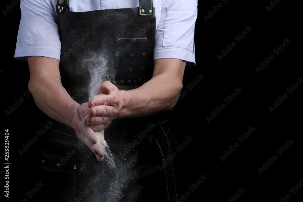 hand clap of chef with flour on black background isolated