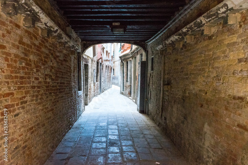 Italy, Venice, CORRIDOR OF OLD BUILDING narrow street empty