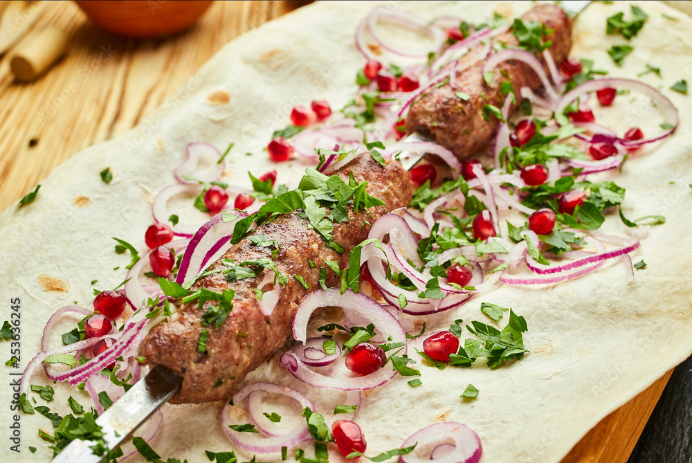 Lula kebab, Georgian dish with meat served by onions and greens in pita bread