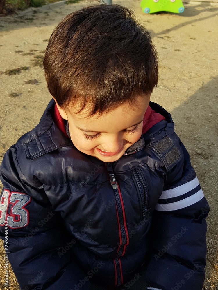 portrait of a boy playing in a playground portrait of a boy playing in a playground