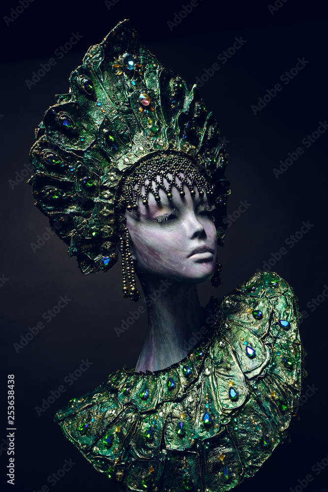 Head of woman mannequin in green decorated kokoshnick Head of woman mannequin in green decorated kokoshnick