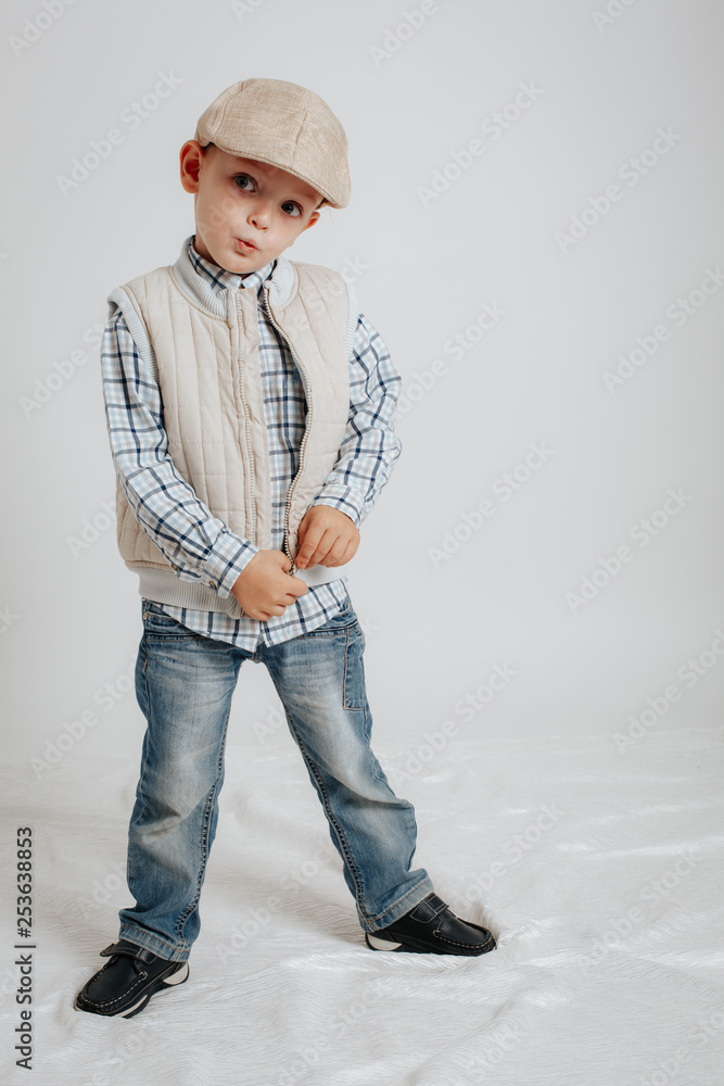 Little boy in a cap posing