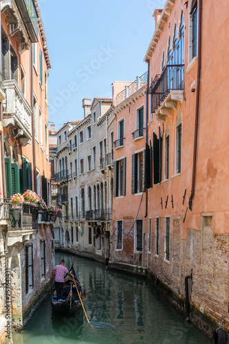 Italy  Venice  Gondolier navigating a gondola near San Moise on a canal