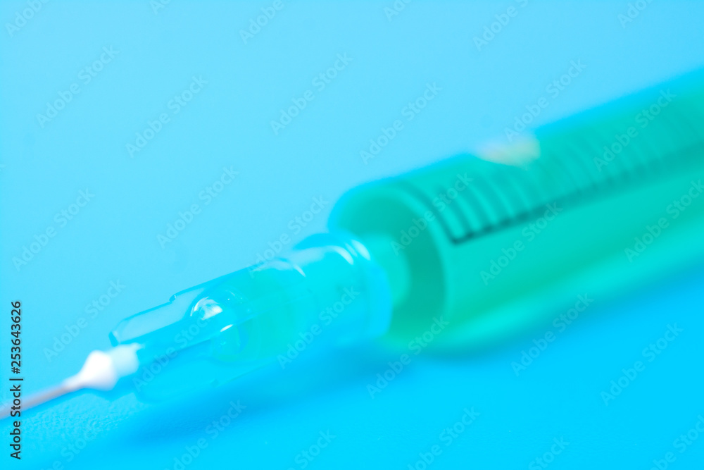 syringe isolated on blue syringe isolated on blue