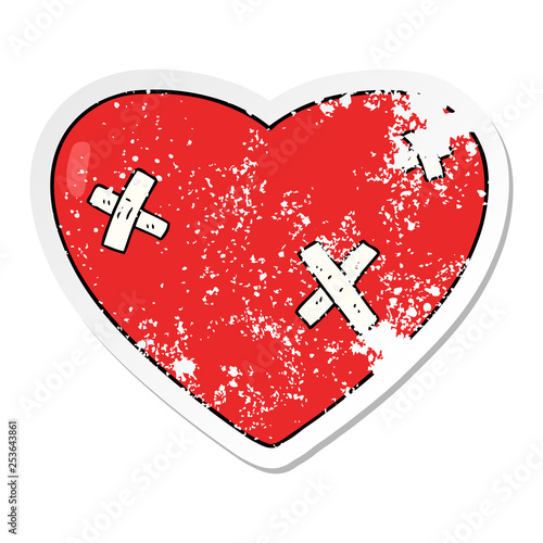 distressed sticker of a cartoon beaten up heart photo