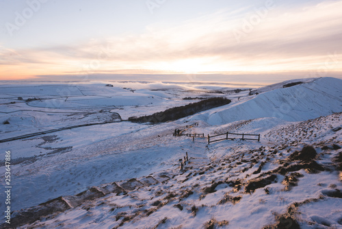 Mam tor covered in Snow during Sunset in the Peak District photo