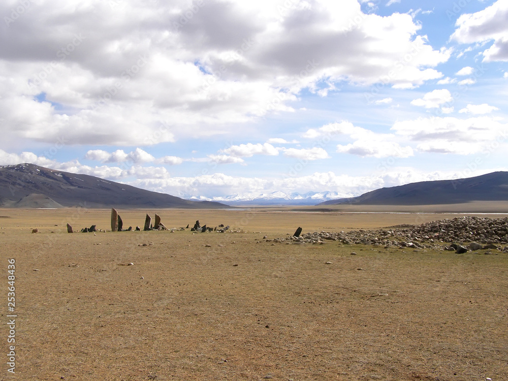 Ancient gravestones in the steppes of the Mongolia. Mongolian Cemetery