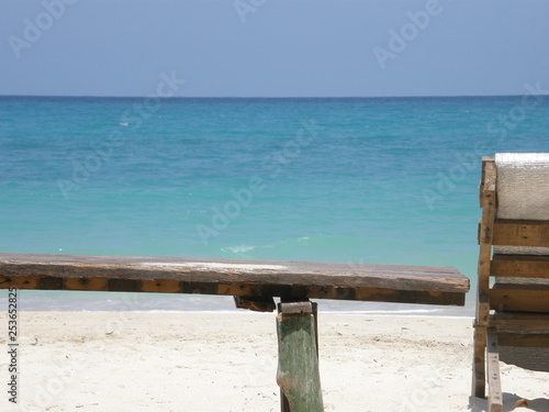 Beach chair and turquoise blue water in Baru Island, Colombia