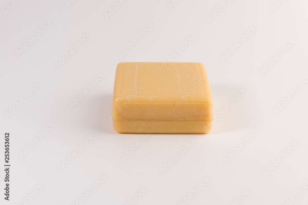 piece of beige soap isolated on a white background piece of beige soap isolated on a white background